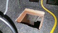 Hole cut through compartment floor